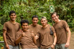Mashpi Lodge guide team with Anderson Orozco, smiling and ready for eco-tours in the Ecuadorian cloud forest.