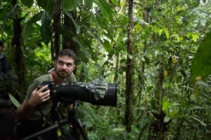 Photographer in the Mashpi Reserve focuses his lens on the hidden gems of the Ecuadorian cloud forest.