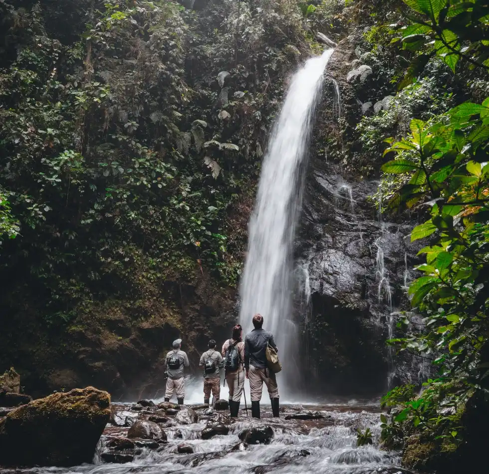 Mashpi hikers at waterfall
